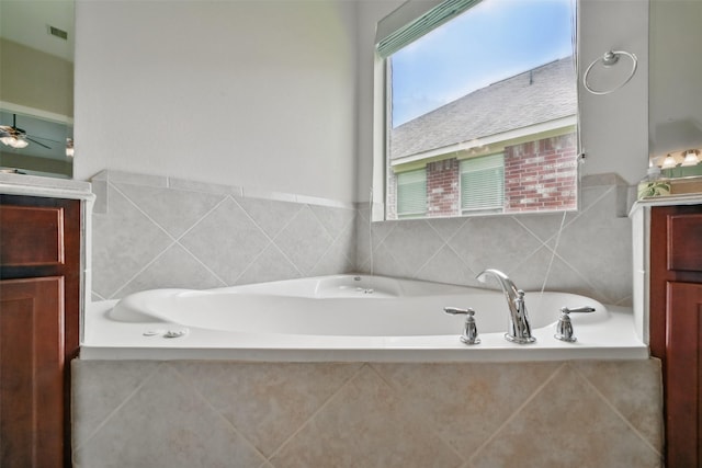 2106 Wild Peregrine Cir, Katy, TX 77494 - full bath featuring vanity, a bath, and a ceiling fan