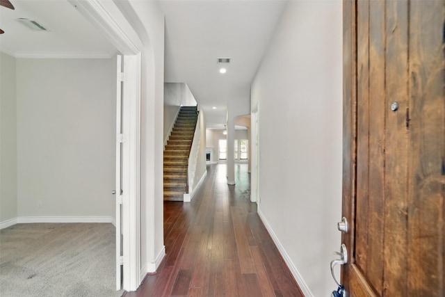 2106 Wild Peregrine Cir, Katy, TX 77494 - corridor with stairway, baseboards, dark wood-type flooring, recessed lighting, and ornamental molding
