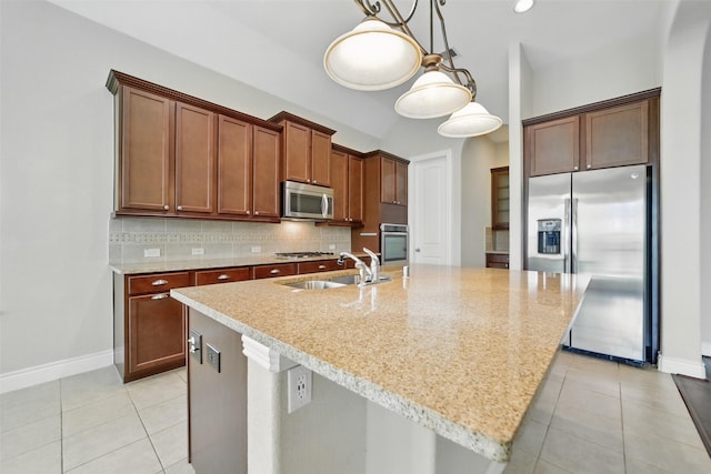 2106 Wild Peregrine Cir, Katy, TX 77494 - kitchen with appliances with stainless steel finishes, a sink, light tile patterned floors, and backsplash