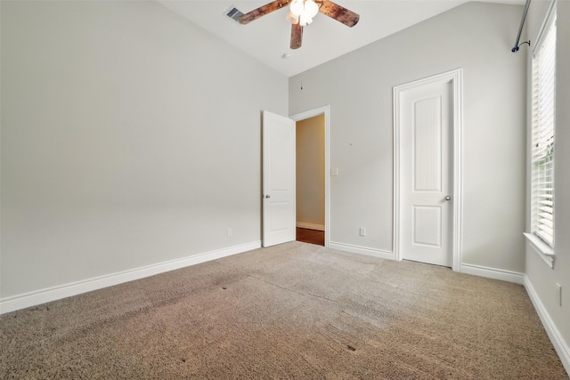 2106 Wild Peregrine Cir, Katy, TX 77494 - unfurnished bedroom with carpet floors, lofted ceiling, baseboards, and a ceiling fan