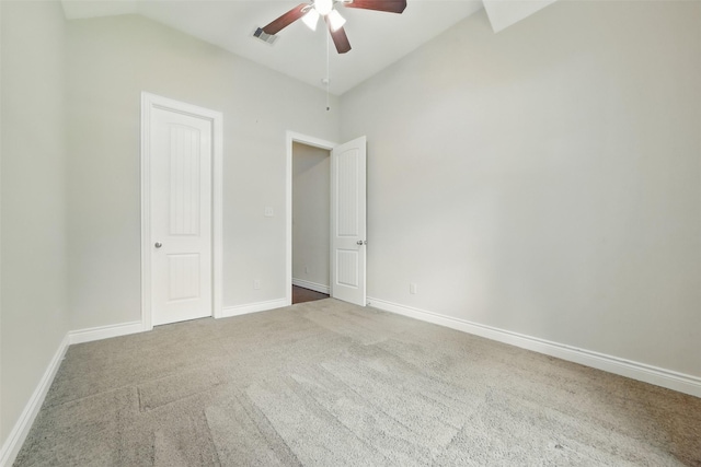 2106 Wild Peregrine Cir, Katy, TX 77494 - unfurnished bedroom with lofted ceiling, carpet flooring, baseboards, and a ceiling fan