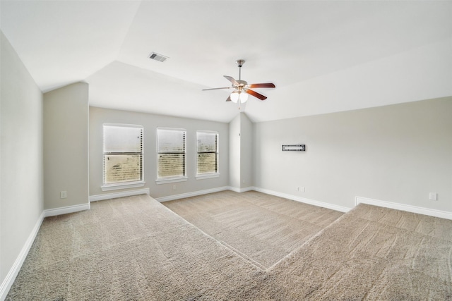2106 Wild Peregrine Cir, Katy, TX 77494 - carpeted empty room with a ceiling fan, baseboards, and lofted ceiling