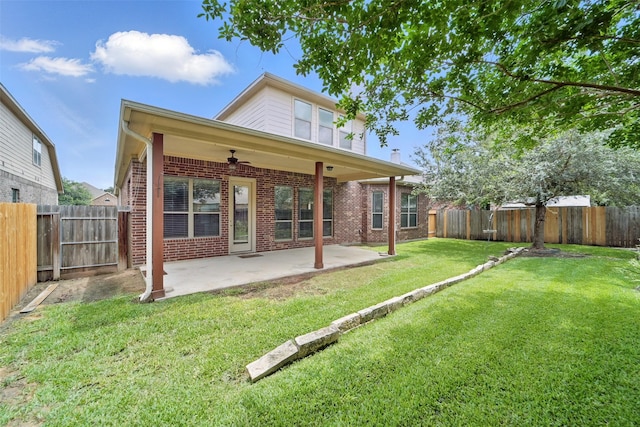 2106 Wild Peregrine Cir, Katy, TX 77494 - back of house with a ceiling fan, brick siding, and a patio