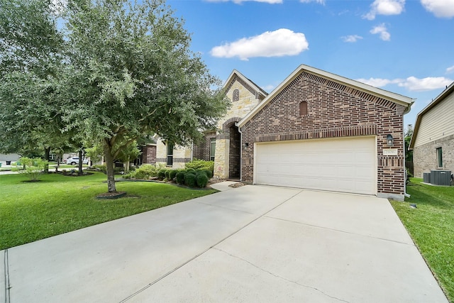2106 Wild Peregrine Cir, Katy, TX 77494 - view of front facade with brick siding, an attached garage, and a front lawn