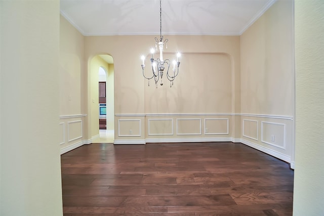 2106 Wild Peregrine Cir, Katy, TX 77494 - unfurnished dining area featuring arched walkways, a chandelier, ornamental molding, wood finished floors, and a decorative wall