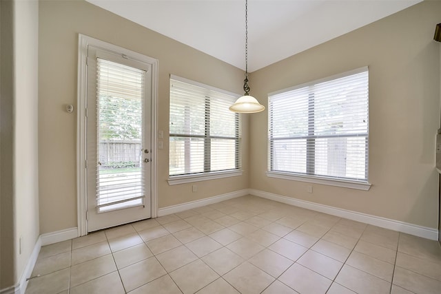 2106 Wild Peregrine Cir, Katy, TX 77494 - unfurnished dining area featuring healthy amount of natural light and light tile patterned flooring