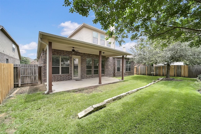 2106 Wild Peregrine Cir, Katy, TX 77494 - rear view of property with ceiling fan, brick siding, a fenced backyard, and a patio area