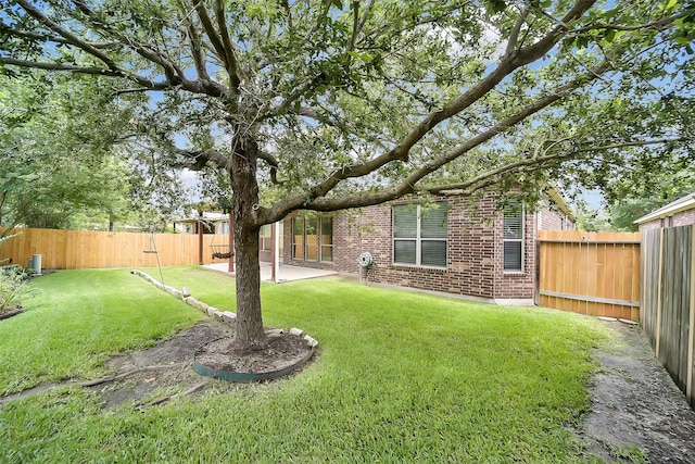 2106 Wild Peregrine Cir, Katy, TX 77494 - fenced backyard featuring a patio area