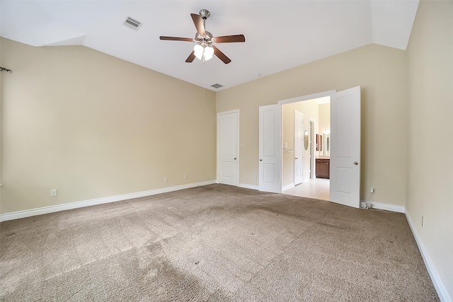 2106 Wild Peregrine Cir, Katy, TX 77494 - unfurnished bedroom with vaulted ceiling, carpet flooring, ceiling fan, and connected bathroom