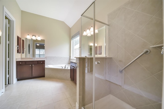 2106 Wild Peregrine Cir, Katy, TX 77494 - bathroom featuring a garden tub, vanity, tile patterned flooring, a shower stall, and lofted ceiling