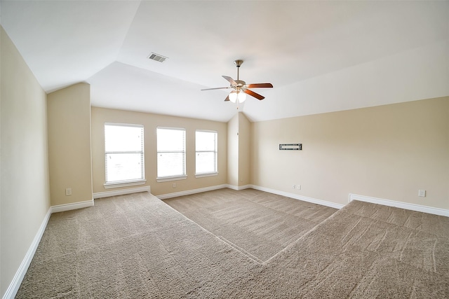 2106 Wild Peregrine Cir, Katy, TX 77494 - spare room with vaulted ceiling, carpet, and a ceiling fan