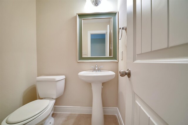 2106 Wild Peregrine Cir, Katy, TX 77494 - bathroom featuring toilet and baseboards