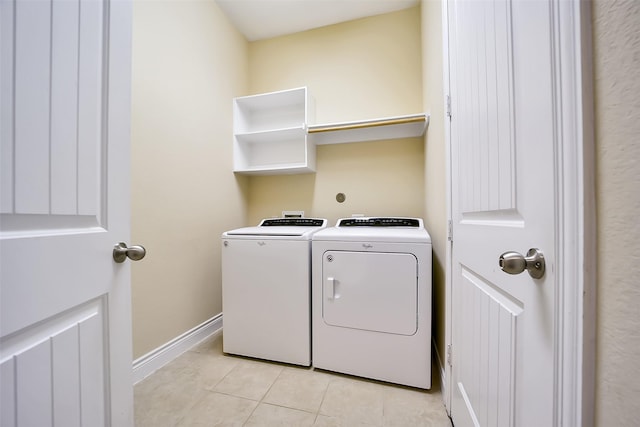 2106 Wild Peregrine Cir, Katy, TX 77494 - washroom featuring washing machine and dryer and light tile patterned floors
