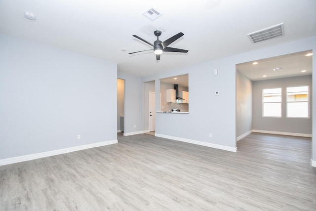 10322 Rancho Bernardo Ln, Sugar Land, TX 77498 - unfurnished living room featuring baseboards, visible vents, and light wood-style floors
