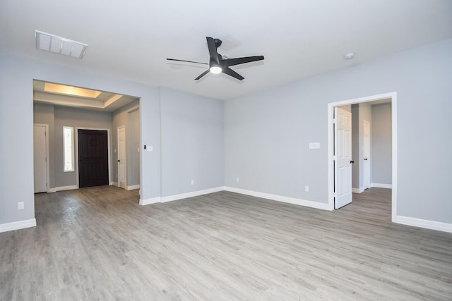 10322 Rancho Bernardo Ln, Sugar Land, TX 77498 - spare room featuring ceiling fan, baseboards, visible vents, and wood finished floors