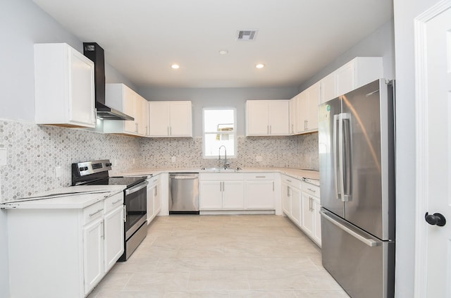 10322 Rancho Bernardo Ln, Sugar Land, TX 77498 - kitchen featuring visible vents, a sink, wall chimney range hood, light countertops, and appliances with stainless steel finishes