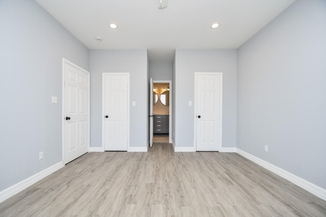 10322 Rancho Bernardo Ln, Sugar Land, TX 77498 - unfurnished bedroom featuring baseboards, light wood-style flooring, and recessed lighting