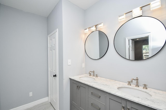 10322 Rancho Bernardo Ln, Sugar Land, TX 77498 - full bath featuring a sink, double vanity, and baseboards