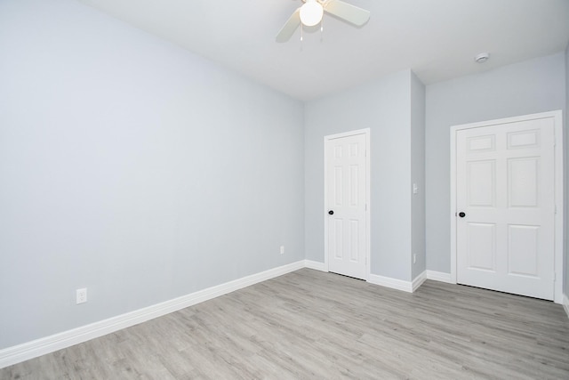 10322 Rancho Bernardo Ln, Sugar Land, TX 77498 - unfurnished bedroom featuring ceiling fan, baseboards, and light wood-type flooring