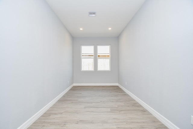 10322 Rancho Bernardo Ln, Sugar Land, TX 77498 - empty room with baseboards, visible vents, and light wood-type flooring