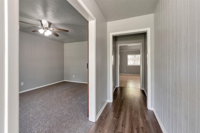 1865 El Mar Ln, Seabrook, TX 77586 - corridor with baseboards, wood finished floors, and a textured ceiling
