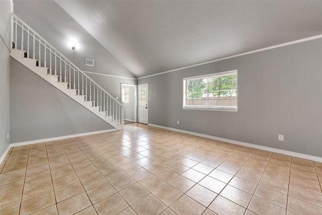 1865 El Mar Ln, Seabrook, TX 77586 - unfurnished living room with stairs, tile patterned flooring, baseboards, lofted ceiling, and crown molding