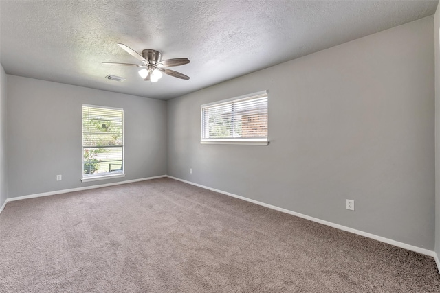1865 El Mar Ln, Seabrook, TX 77586 - carpeted empty room with healthy amount of natural light, ceiling fan, a textured ceiling, and baseboards