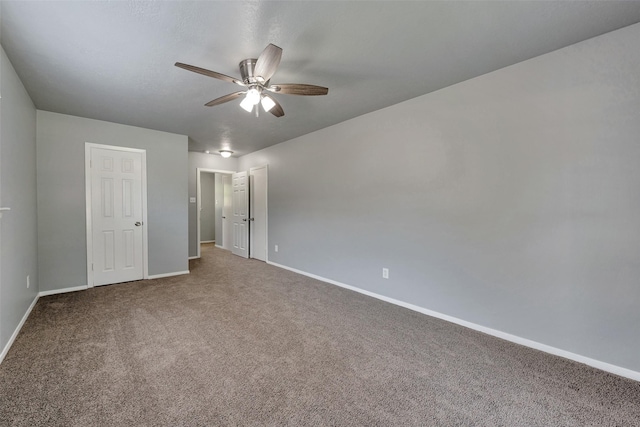 1865 El Mar Ln, Seabrook, TX 77586 - unfurnished bedroom with baseboards, carpet, and a ceiling fan