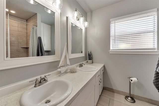 1865 El Mar Ln, Seabrook, TX 77586 - full bathroom with tile patterned flooring, double vanity, baseboards, and a shower with curtain