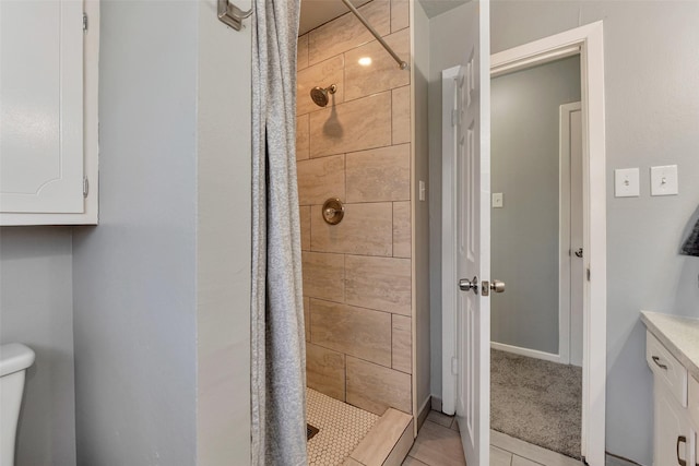 1865 El Mar Ln, Seabrook, TX 77586 - bathroom featuring a stall shower, tile patterned floors, and toilet