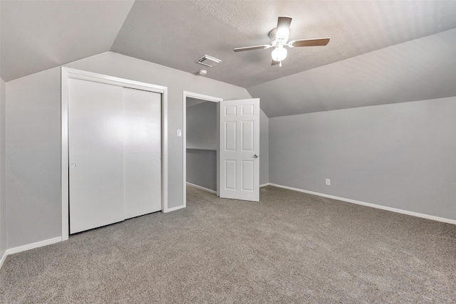 1865 El Mar Ln, Seabrook, TX 77586 - additional living space with vaulted ceiling, a ceiling fan, carpet, baseboards, and a textured ceiling