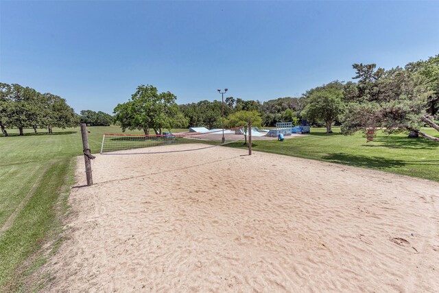 1865 El Mar Ln, Seabrook, TX 77586 - view of community with volleyball court, a yard, and view of scattered trees