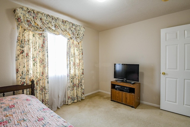 3222 Mossy Elm Ct, Houston, TX 77059 - bedroom featuring light colored carpet and baseboards