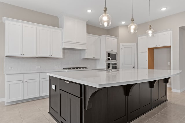 kitchen with white cabinets and light tile patterned flooring