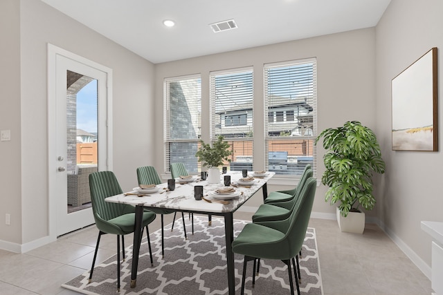 dining room featuring visible vents, baseboards, light tile patterned flooring, and recessed lighting