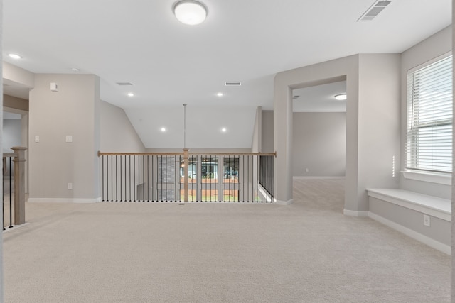spare room featuring carpet flooring, visible vents, baseboards, and recessed lighting