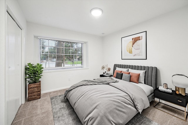 2435 Cypresstree Dr, Spring, TX 77373 - carpeted bedroom featuring a closet and baseboards
