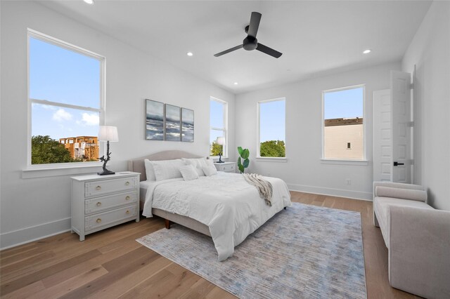 5703 Dolores St Unit A, Houston, TX 77057 - bedroom with light wood-style flooring, recessed lighting, baseboards, and ceiling fan
