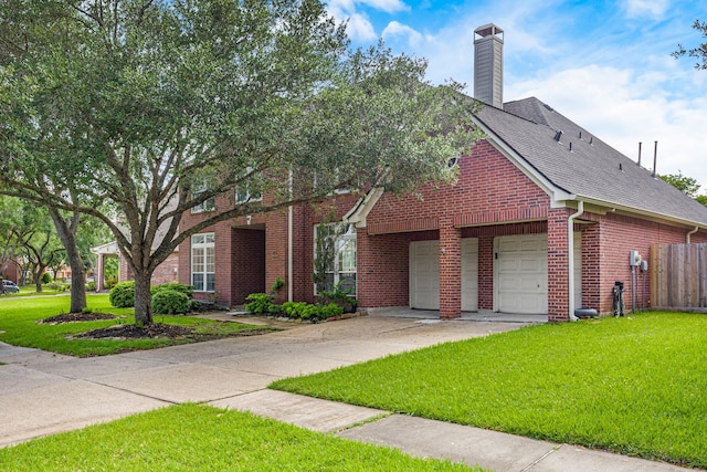 view of front of house featuring fence, an attached garage, brick siding, concrete driveway, and a front yard