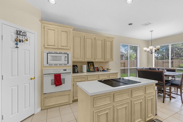 kitchen with white appliances, visible vents, an inviting chandelier, light countertops, and light tile patterned floors