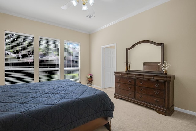bedroom featuring a ceiling fan, baseboards, visible vents, crown molding, and light colored carpet