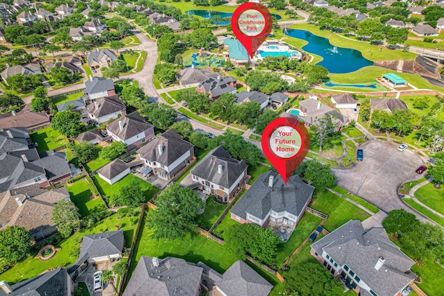 bird's eye view featuring a water view and a residential view