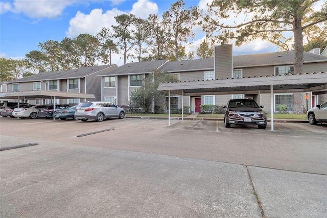 14911 Wunderlich Dr Unit 609, Houston, TX 77069 - view of property with covered and uncovered parking and a residential view