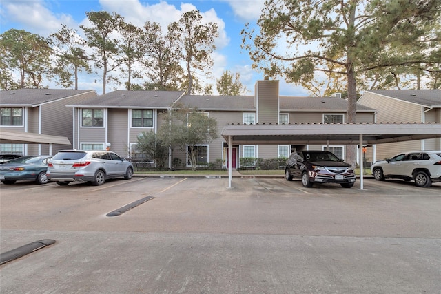 14911 Wunderlich Dr Unit 609, Houston, TX 77069 - view of building exterior featuring covered and uncovered parking