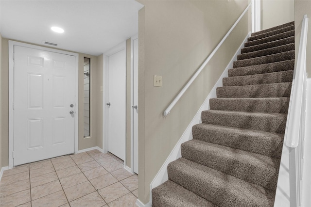 14911 Wunderlich Dr Unit 609, Houston, TX 77069 - foyer entrance with light tile patterned floors, stairway, baseboards, and visible vents
