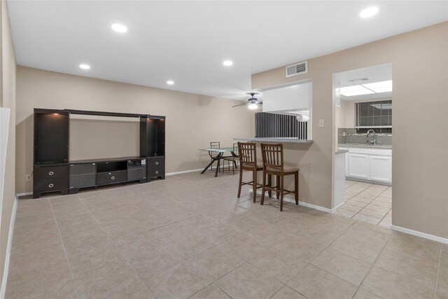 14911 Wunderlich Dr Unit 609, Houston, TX 77069 - living room with light tile patterned flooring, visible vents, recessed lighting, a ceiling fan, and baseboards