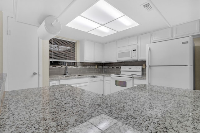 14911 Wunderlich Dr Unit 609, Houston, TX 77069 - kitchen featuring white cabinetry, white appliances, light stone counters, and backsplash
