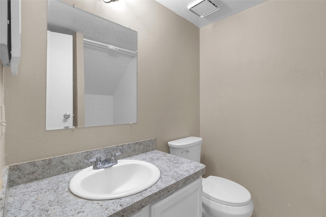 14911 Wunderlich Dr Unit 609, Houston, TX 77069 - half bath featuring vanity, toilet, a textured ceiling, and visible vents