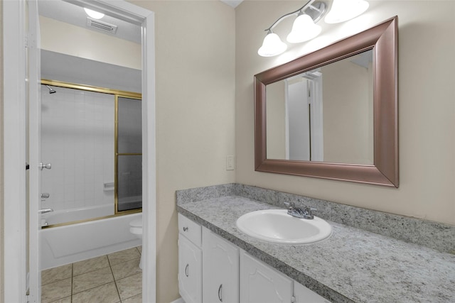 14911 Wunderlich Dr Unit 609, Houston, TX 77069 - full bathroom featuring toilet, visible vents, tile patterned flooring, vanity, and combined bath / shower with glass door