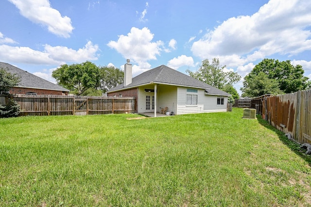 21111 Diamond Rock Ct, Katy, TX 77449 - back of property with french doors, a chimney, and central air condition unit